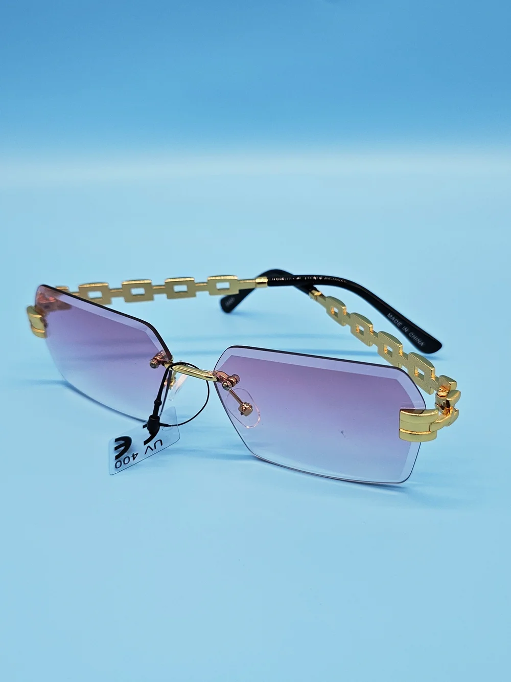 Gold-Chain Rimless Sunglasses with Purple Gradient Lenses
